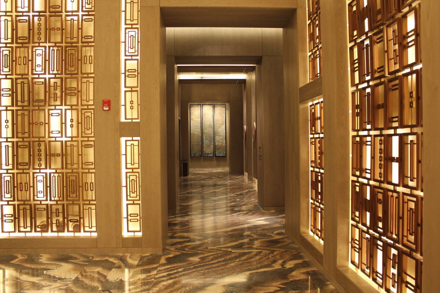 a hallway with a marble floor and a marble floor