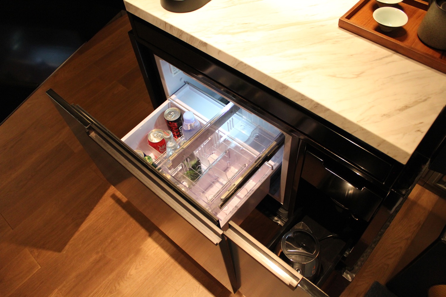 a refrigerator with a drawer open