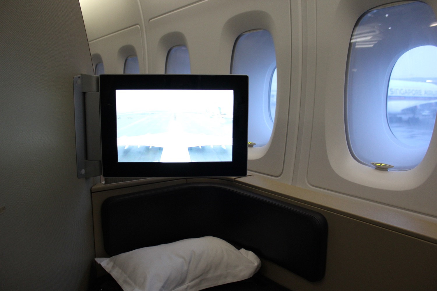 a tv on a seat in an airplane