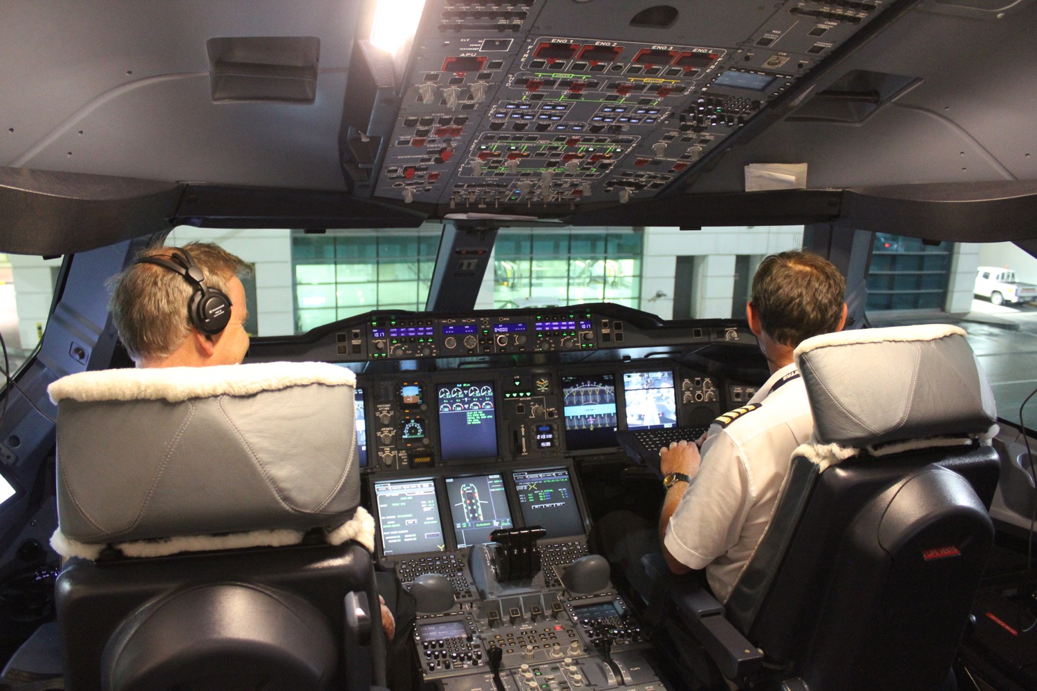 a group of men in a cockpit