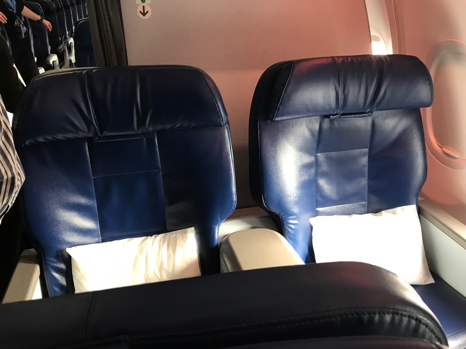 a pair of blue seats in an airplane