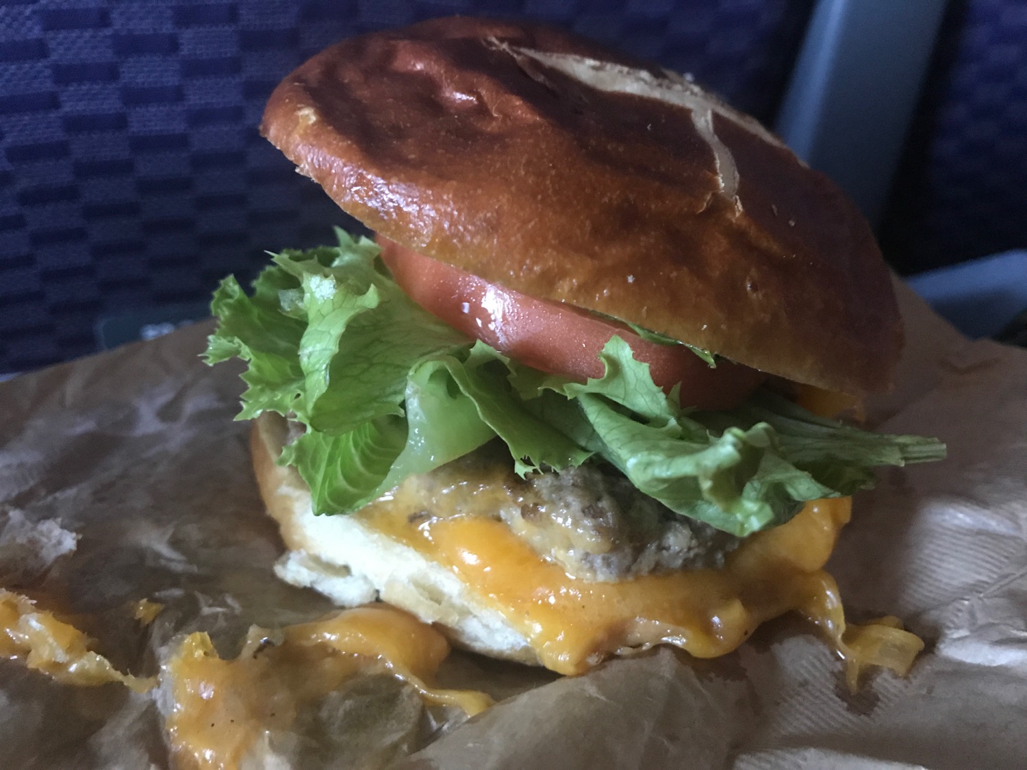 a cheeseburger on a brown paper