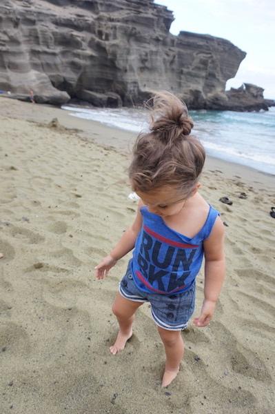 Lucy playing in green sand.