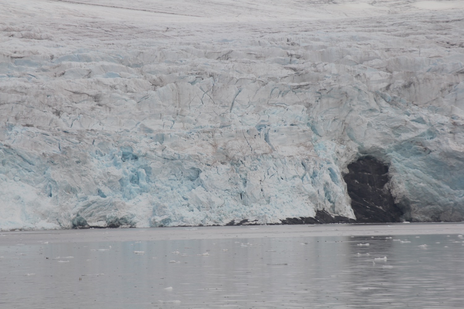 a glacier next to water