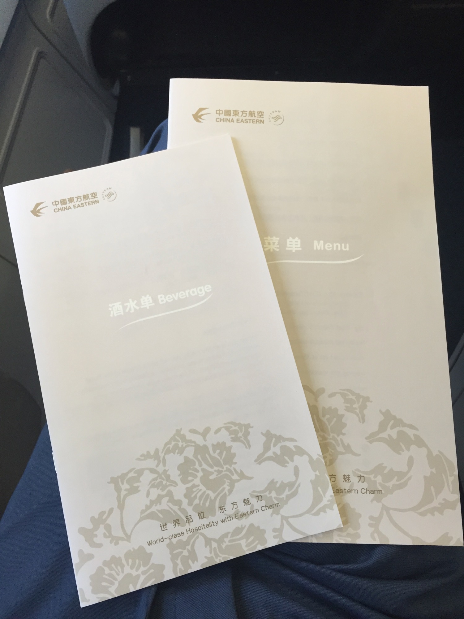 a couple of white paper with text on it