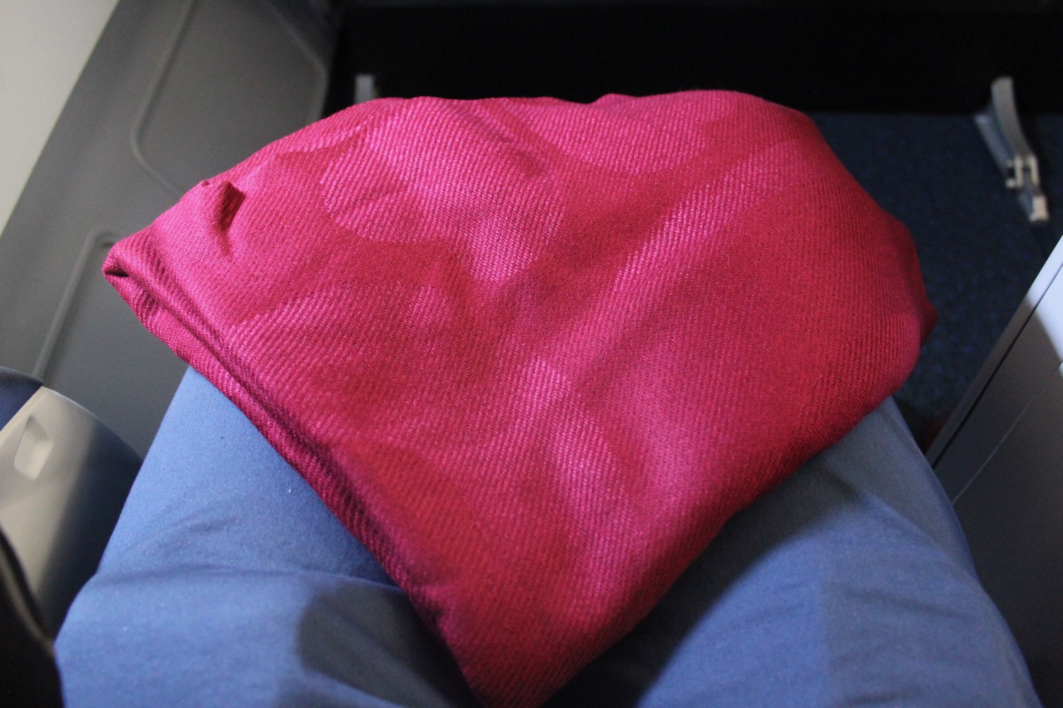 a red pillow on a blue pillow