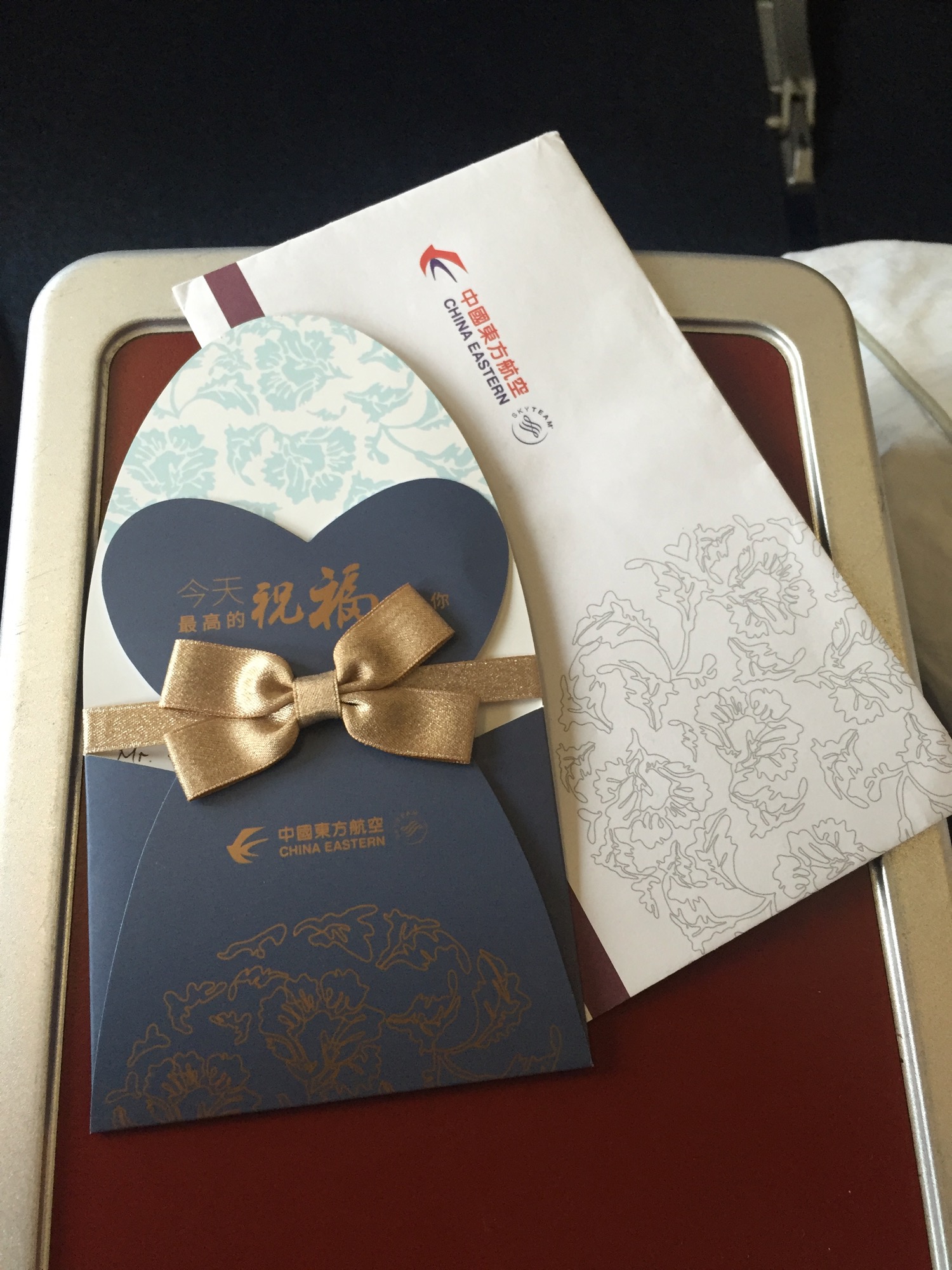 a envelope and a card on a tray