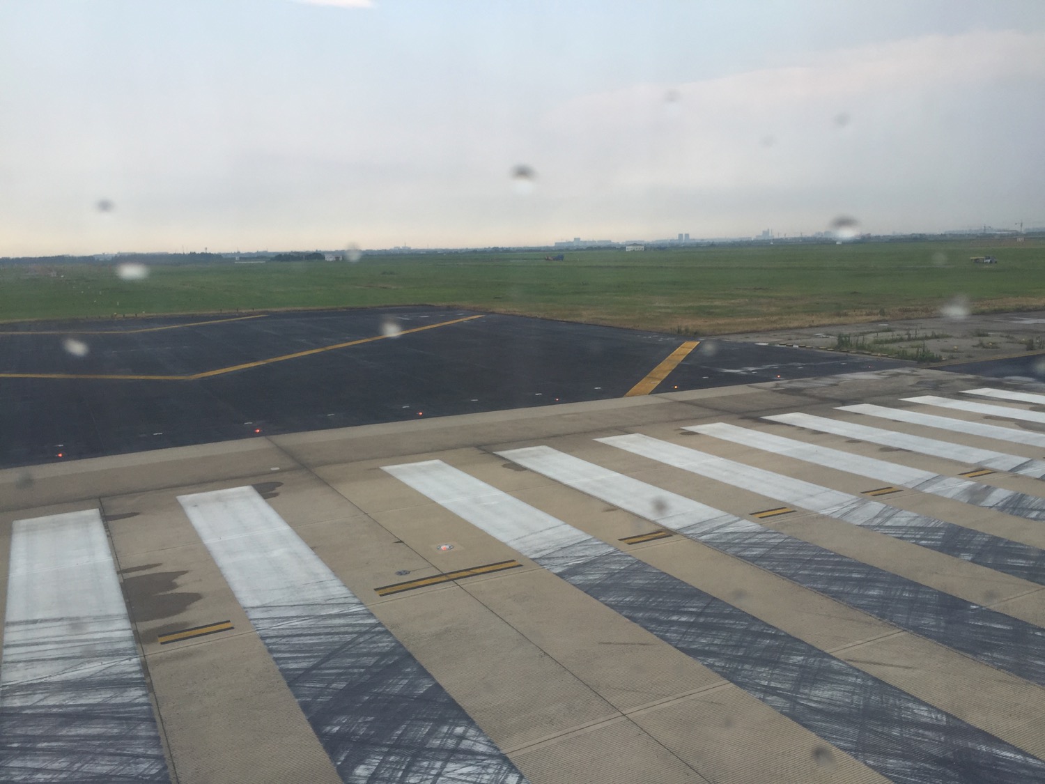 a runway with a field in the background