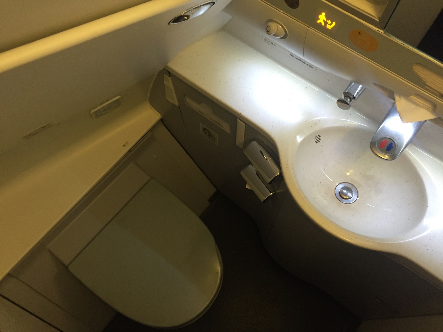 a sink and toilet in an airplane