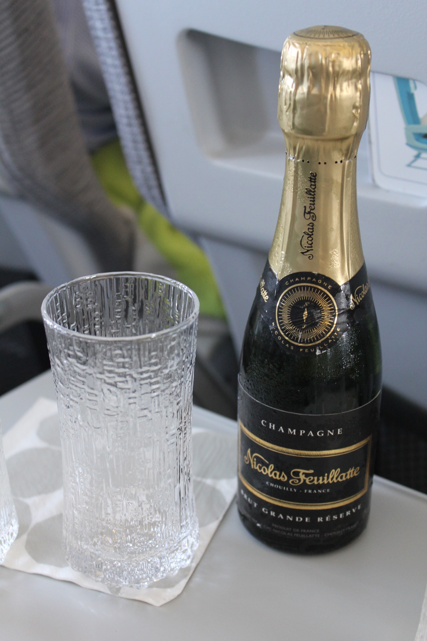 a bottle of champagne next to a glass
