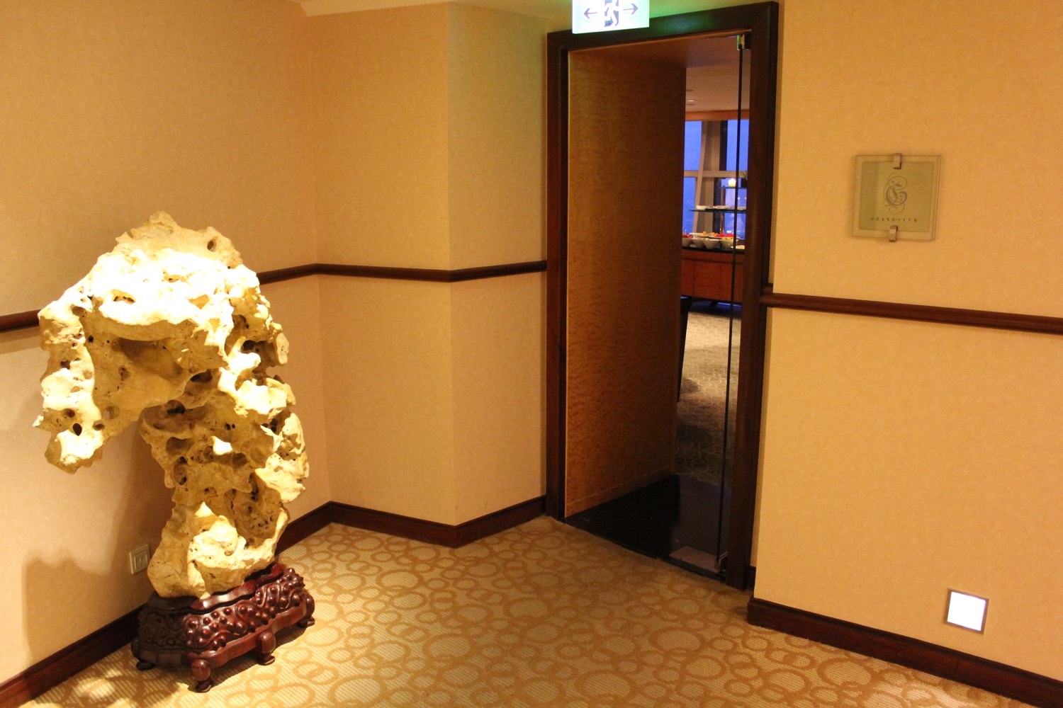 a large rock on a stand in a room