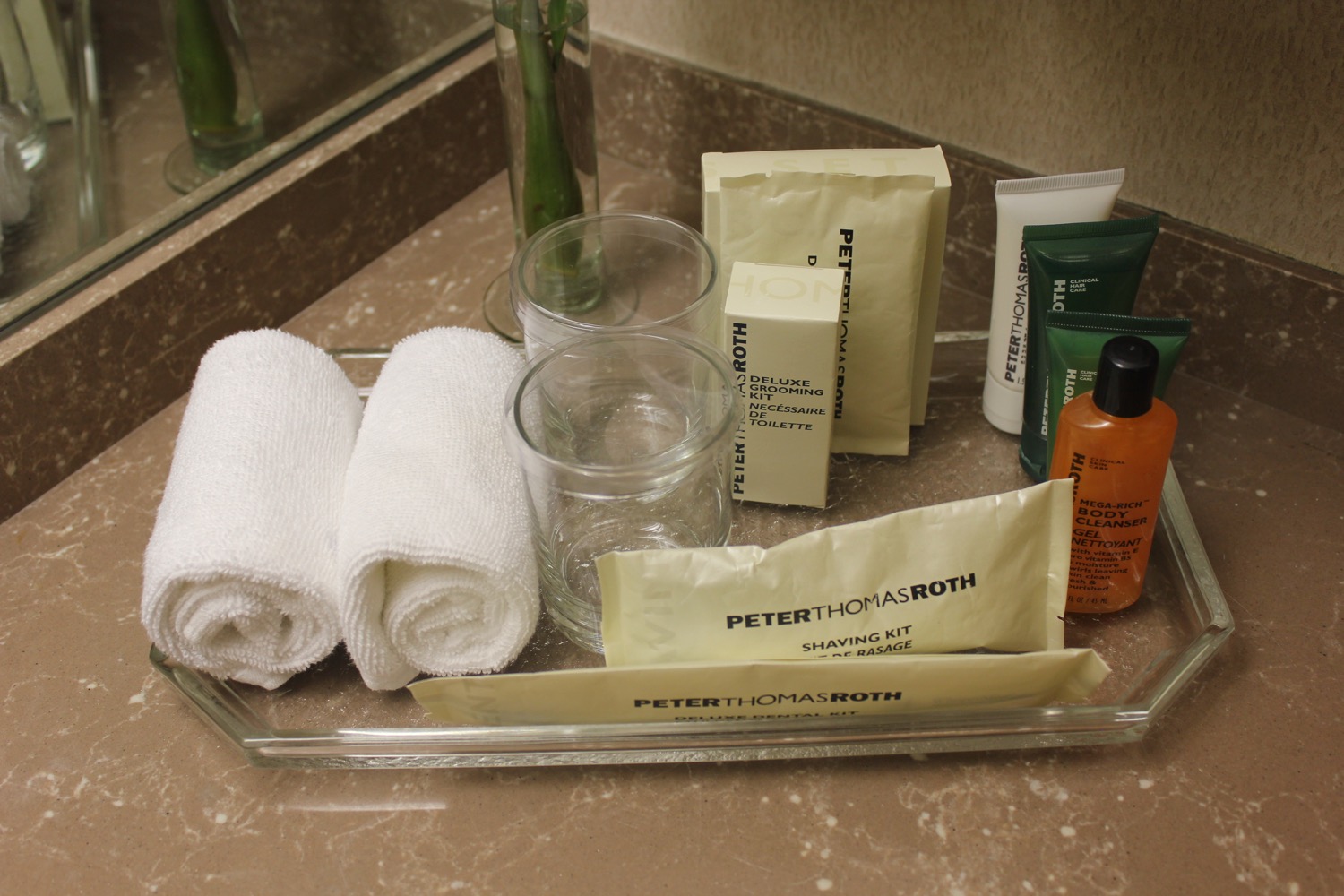 a tray of toiletries and towels