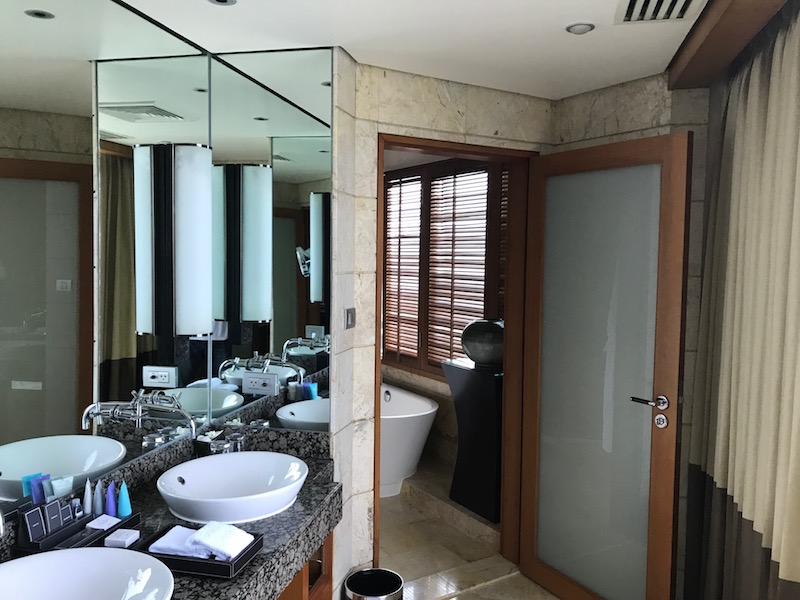 Double vanity leading into the bathroom
