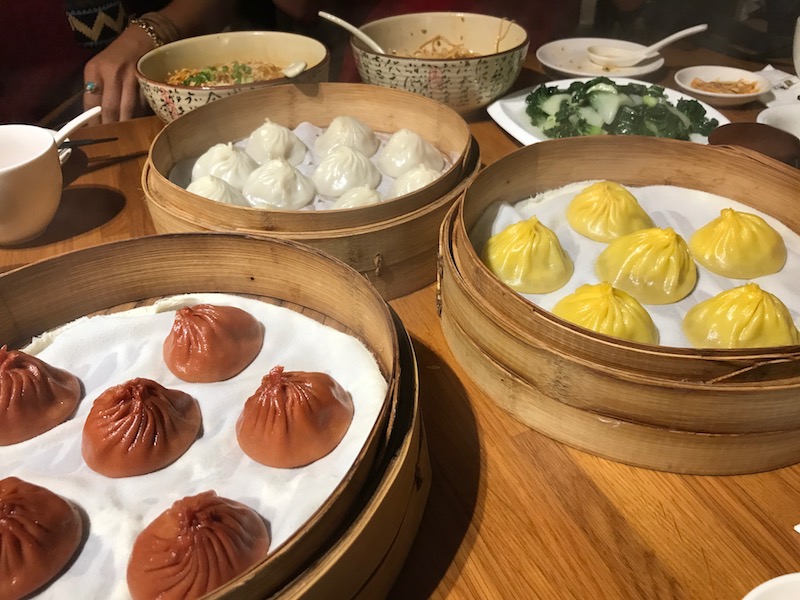 a group of dim sum on a table