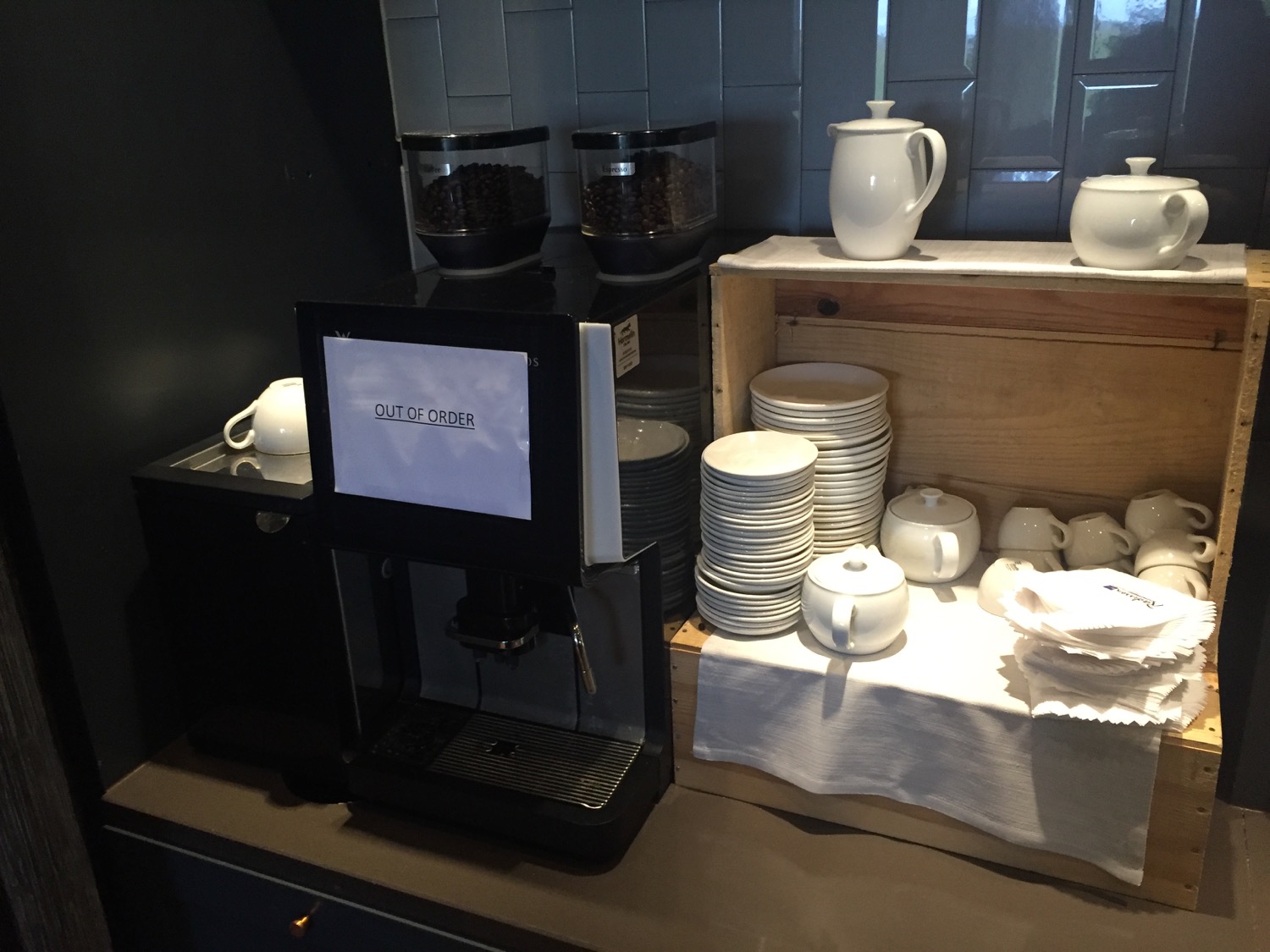 a coffee machine and a stack of plates