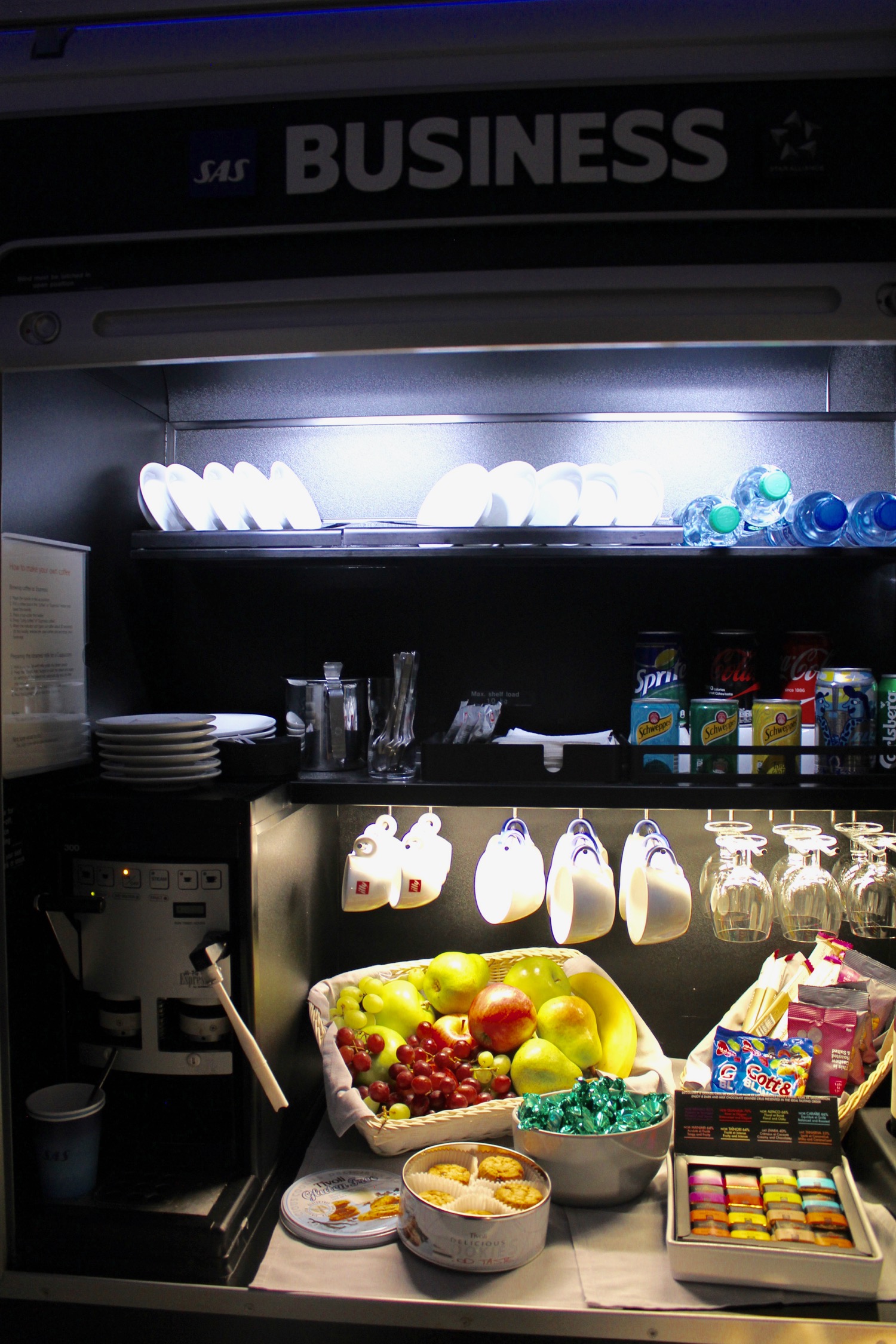 a refrigerator with a shelf full of food and drinks