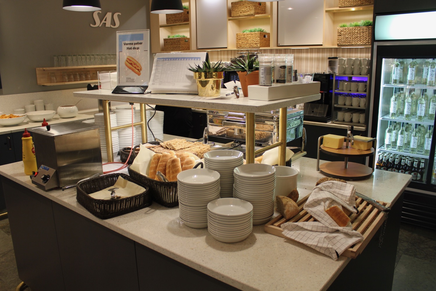a counter with a variety of dishes and bread
