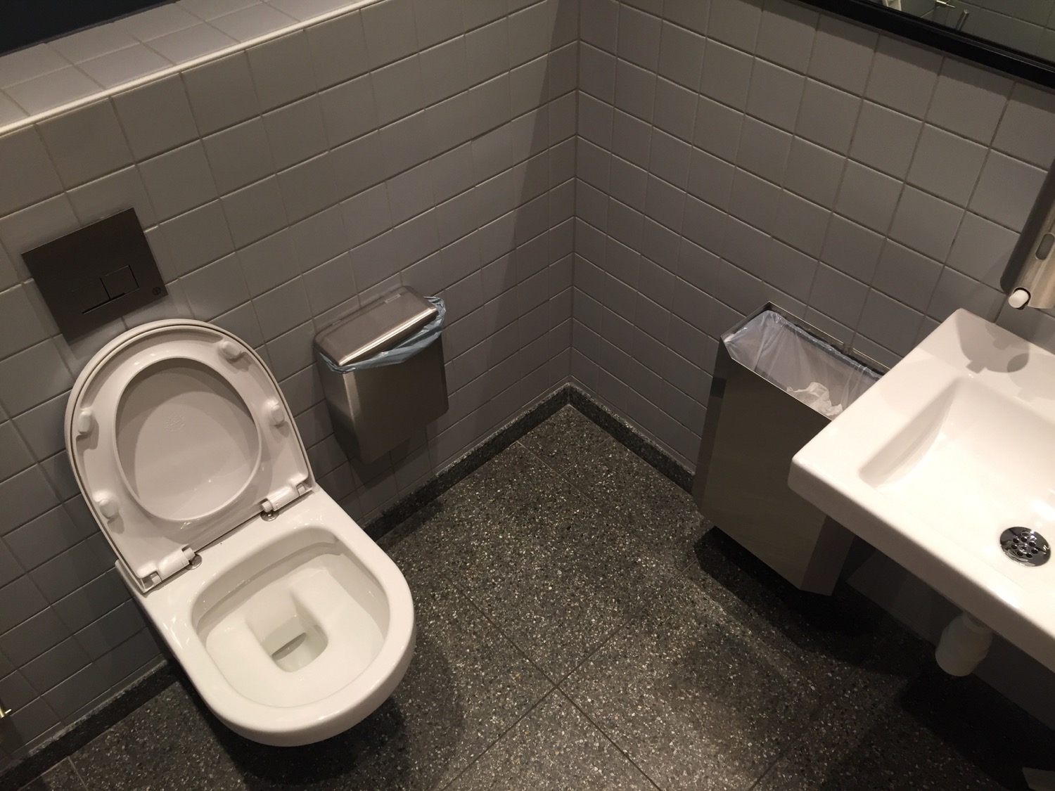 a toilet and sink in a bathroom