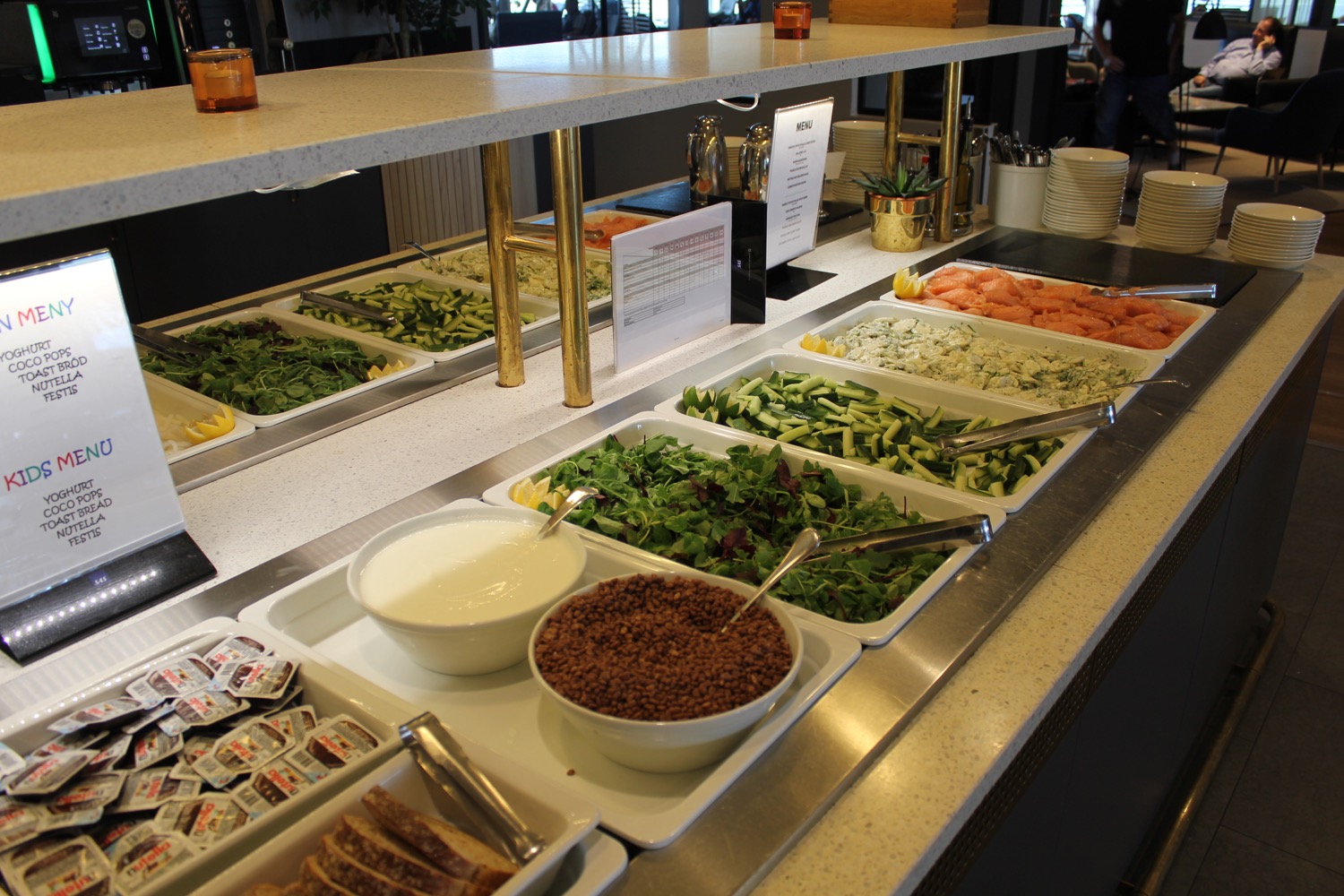 a buffet line with different food items