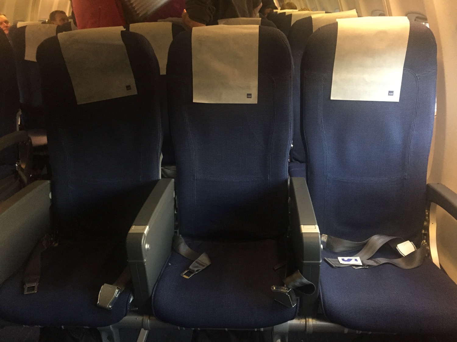 a row of seats with a seat belt and a seat belt