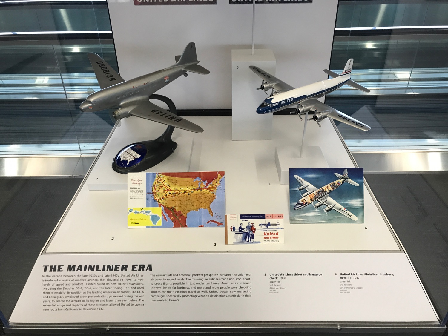 a display of model airplanes and a map
