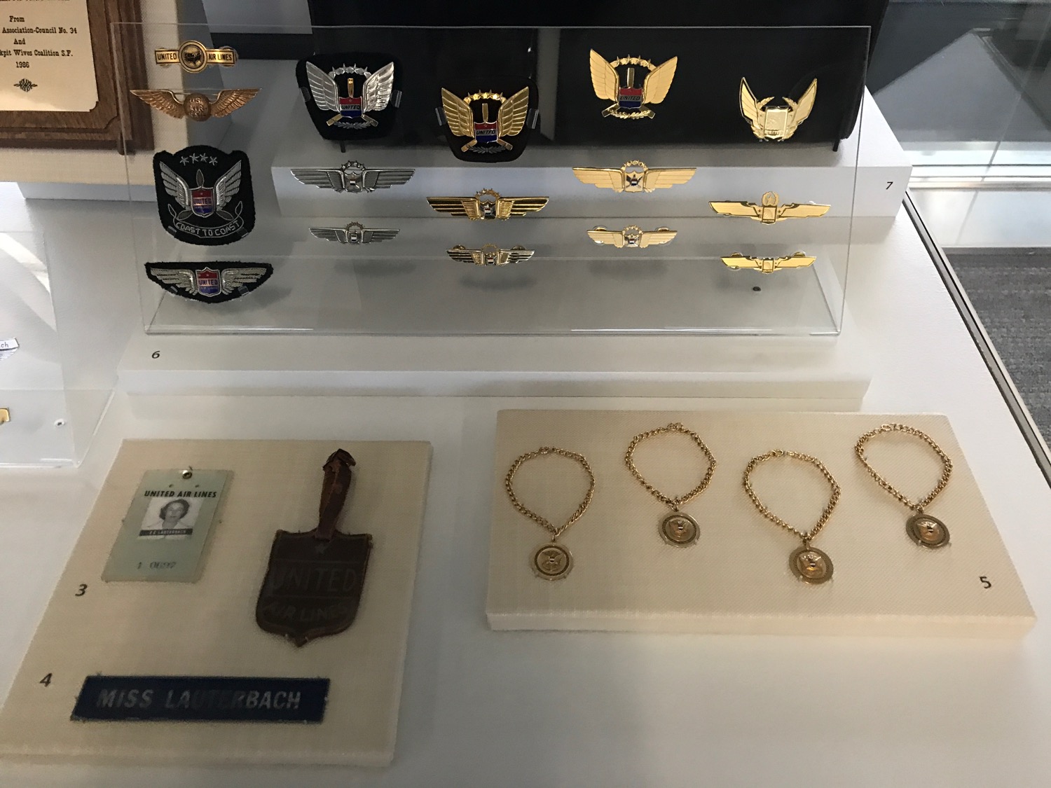 a display case with medals and badges