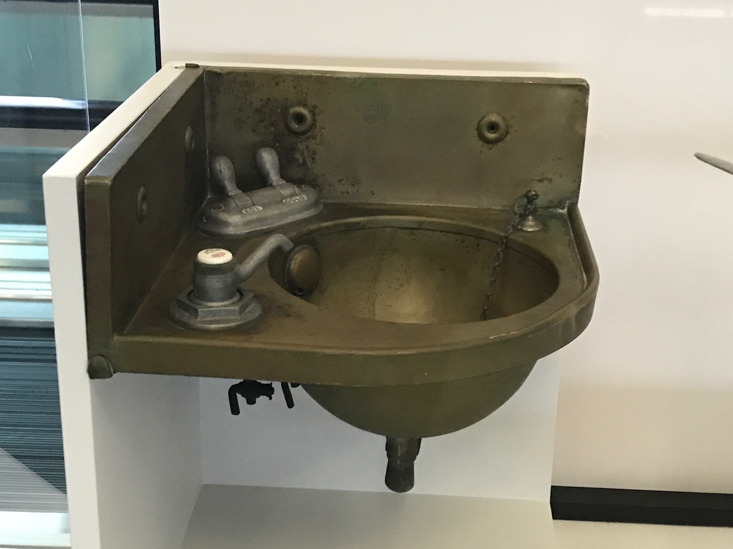 a sink with faucet and tap