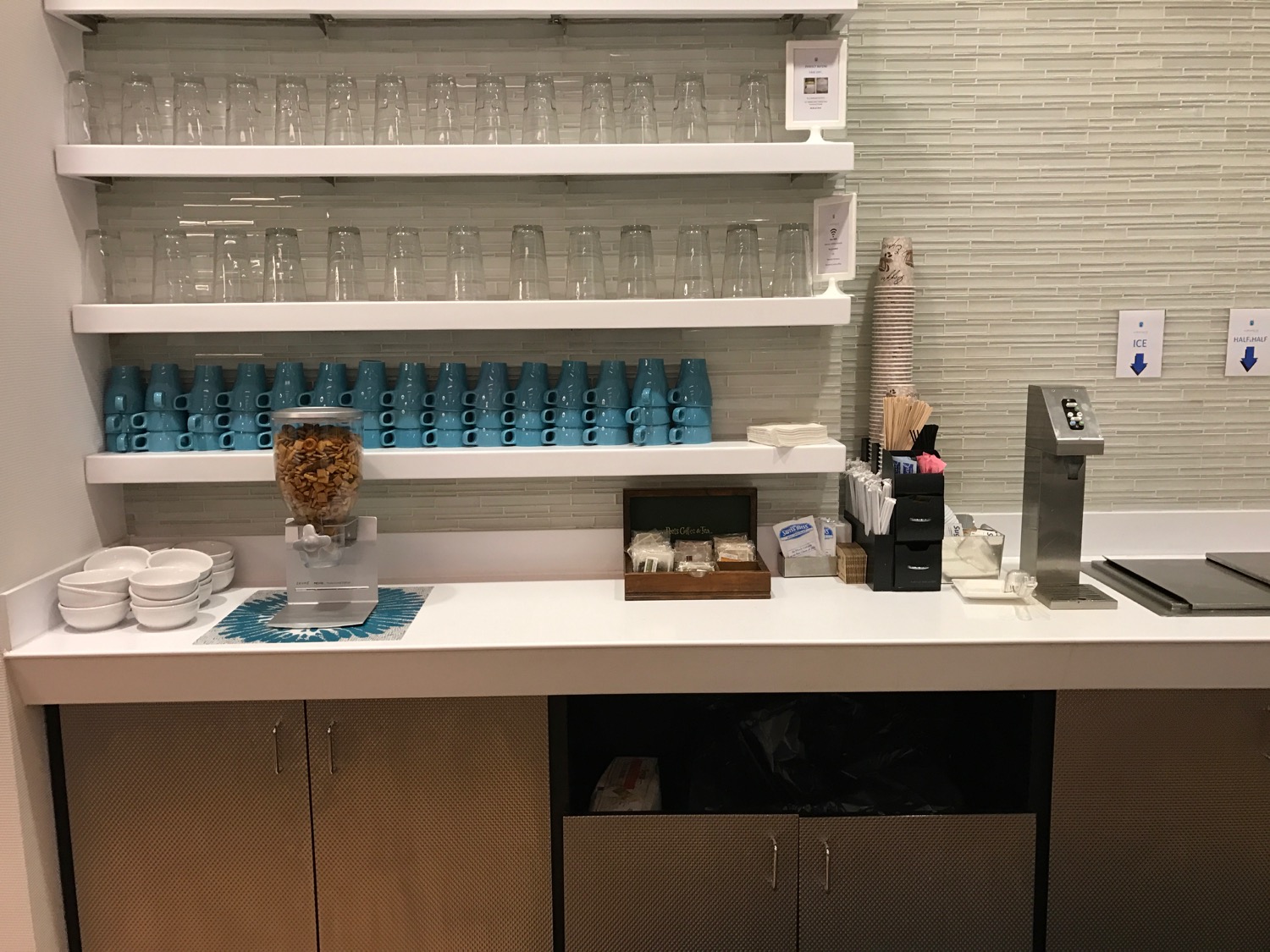 a counter with a variety of glasses on it
