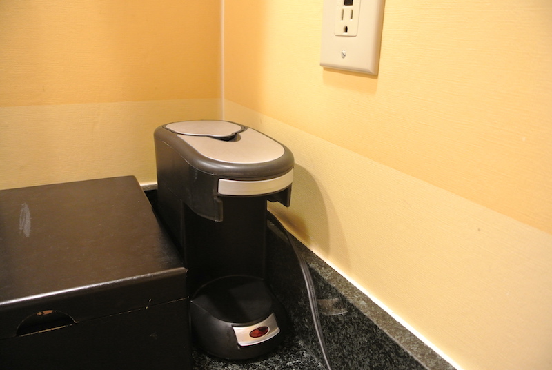 Beat up amenities box and unforgivable basic coffee maker IN THE BATHROOM!