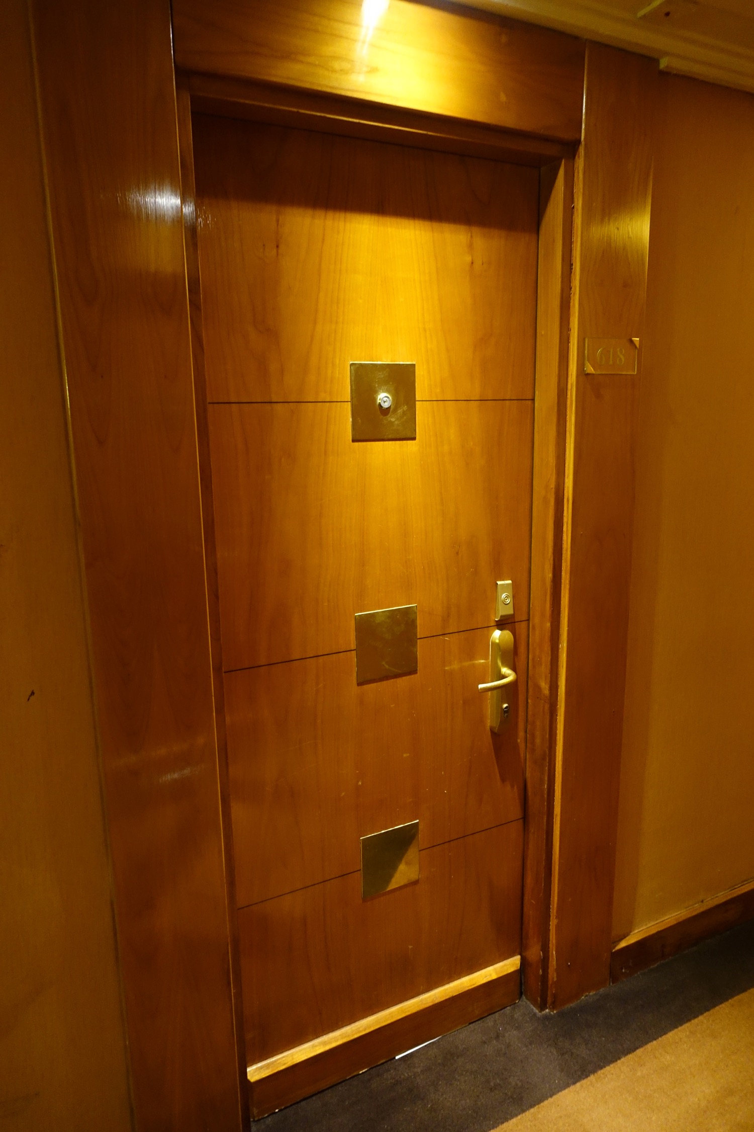 a wooden door with a handle and a door knob