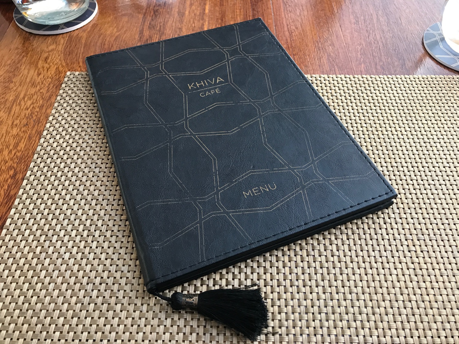 a black menu book on a table