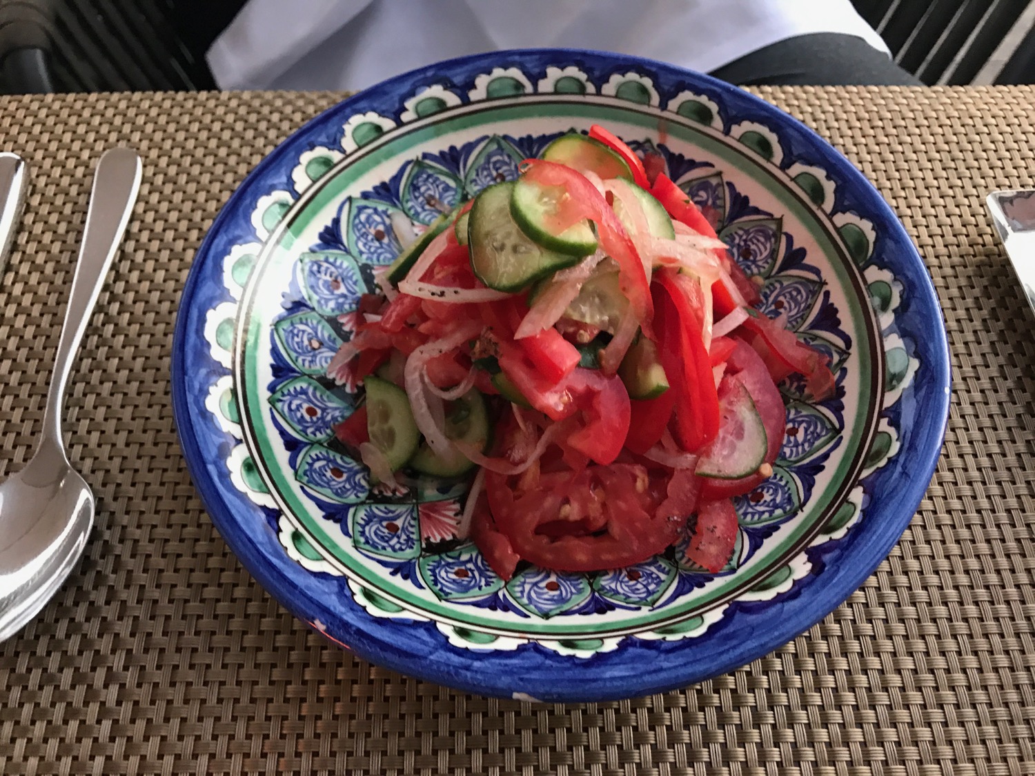 a plate of salad with vegetables