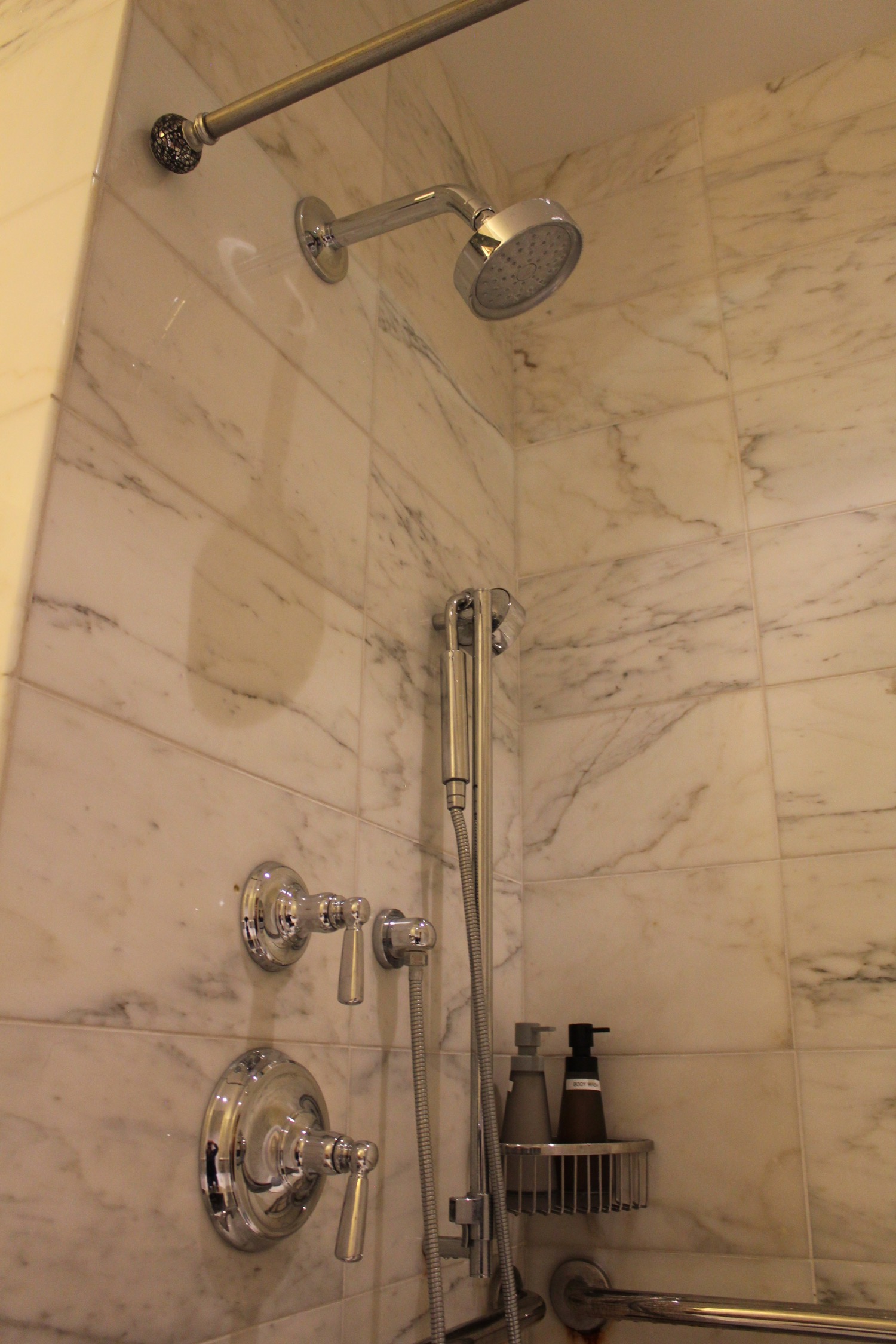 a shower head and faucet in a bathroom
