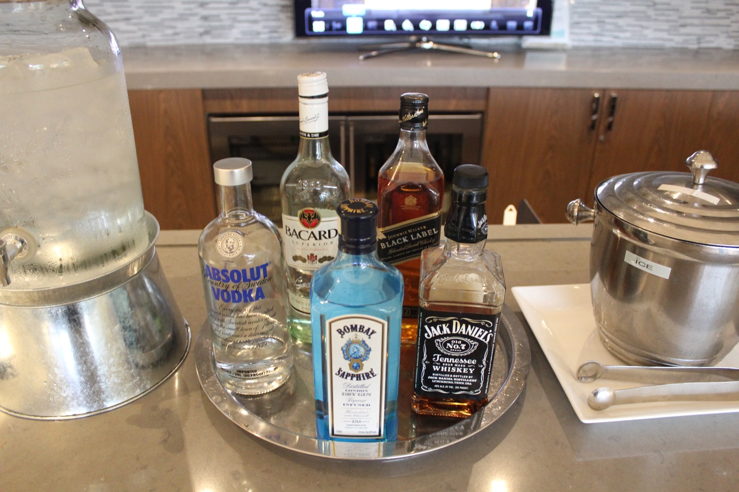 a group of bottles of alcohol on a tray