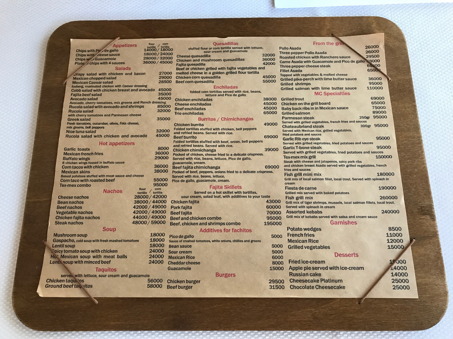 a menu on a wooden board