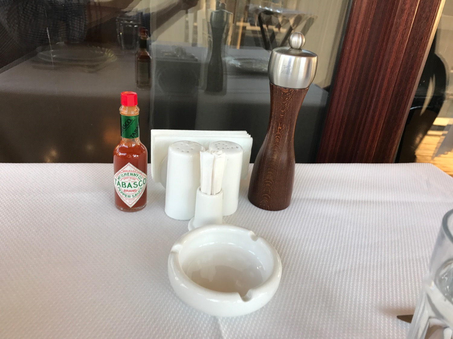 a salt shaker and pepper shakers on a table