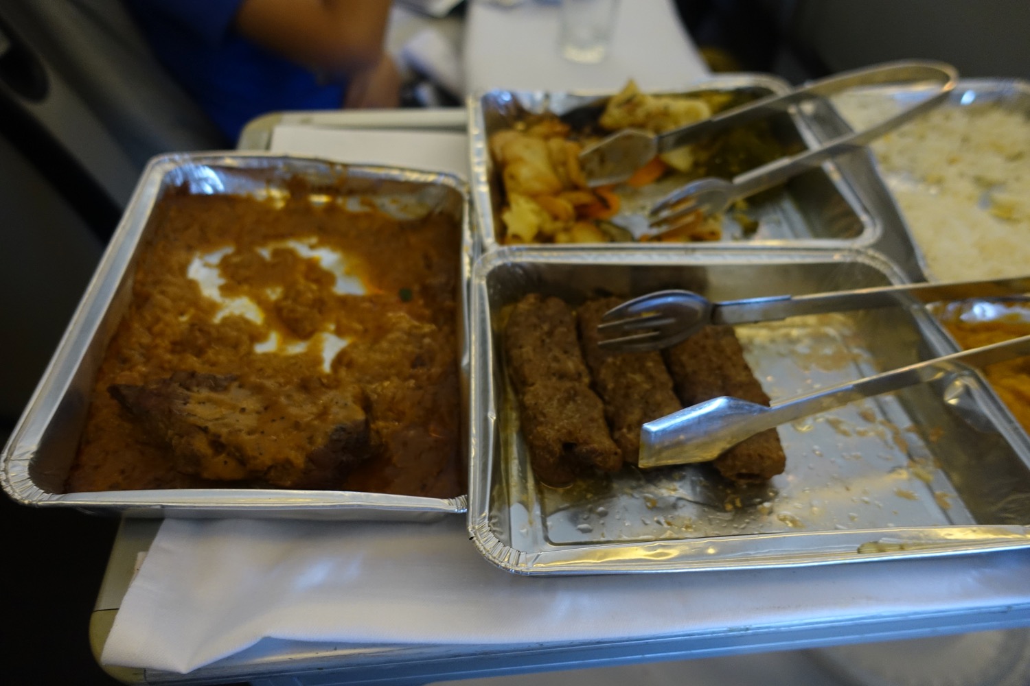 a trays of food with forks