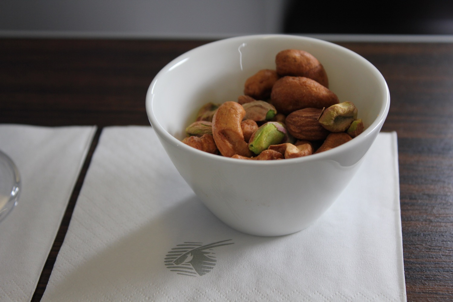 a bowl of nuts on a napkin