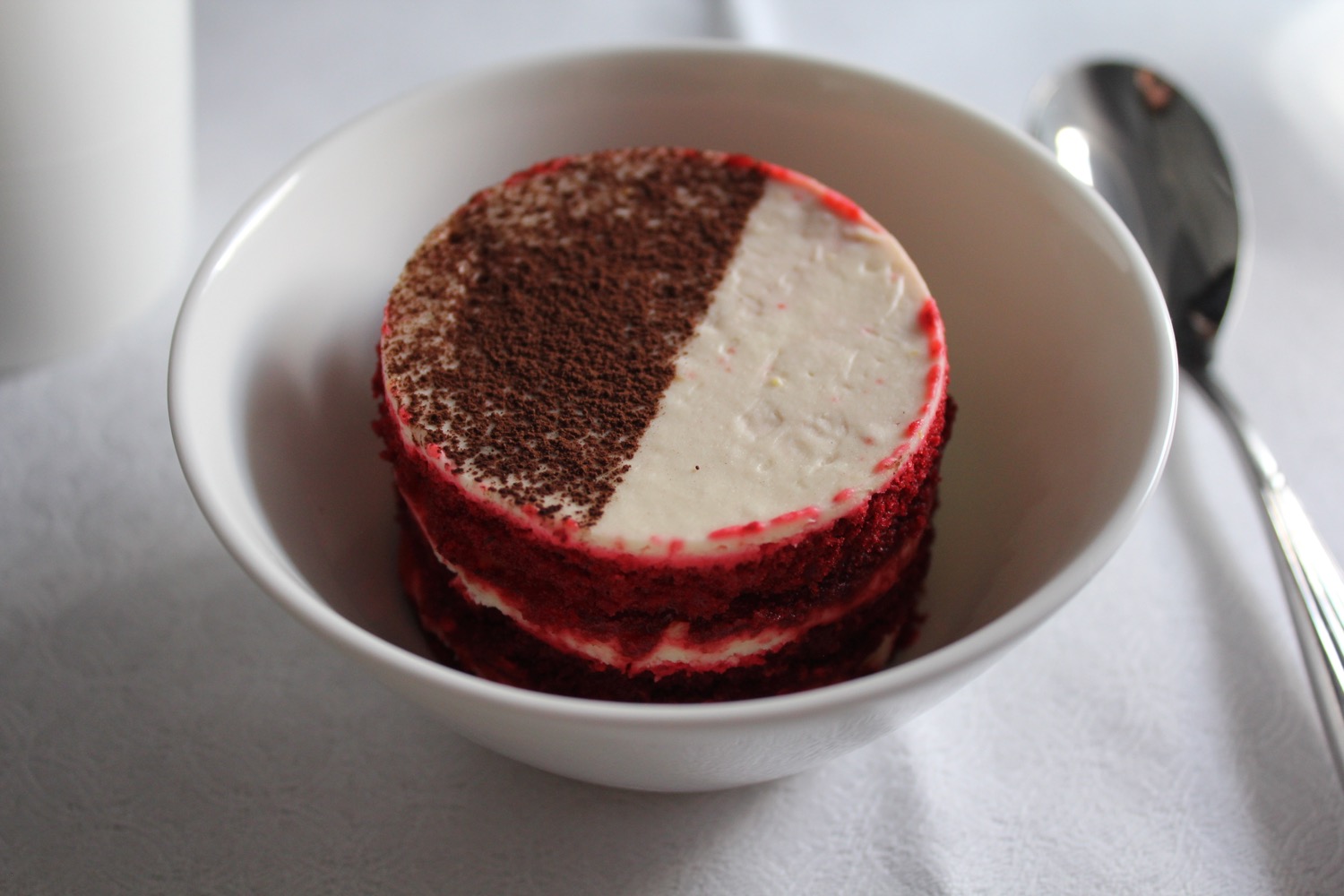 a red and white cake in a bowl