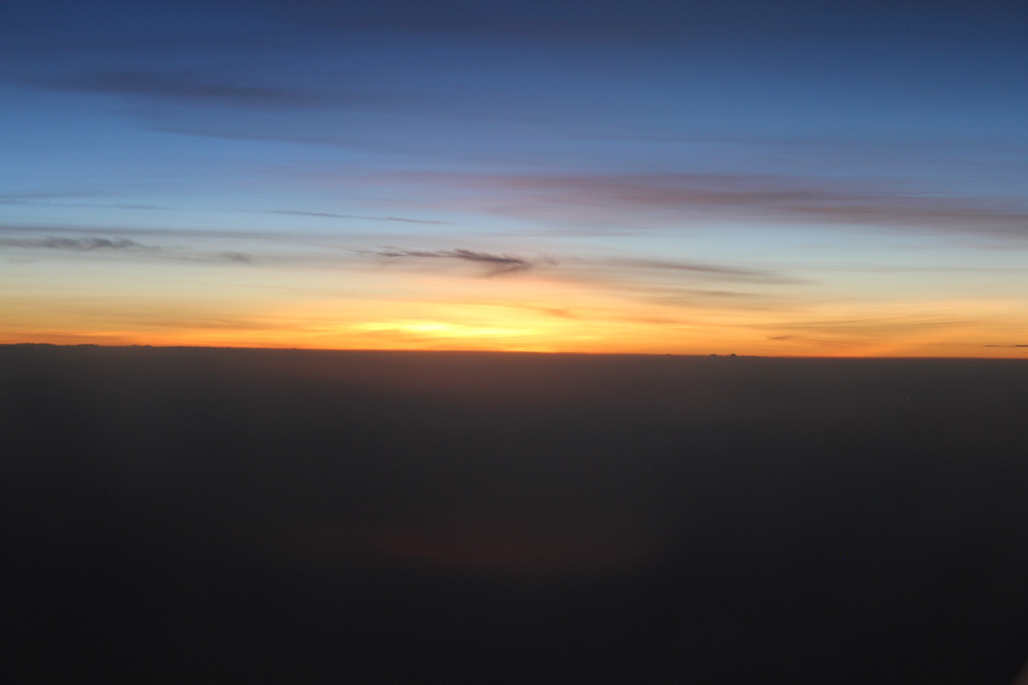 a sunset over a cloud