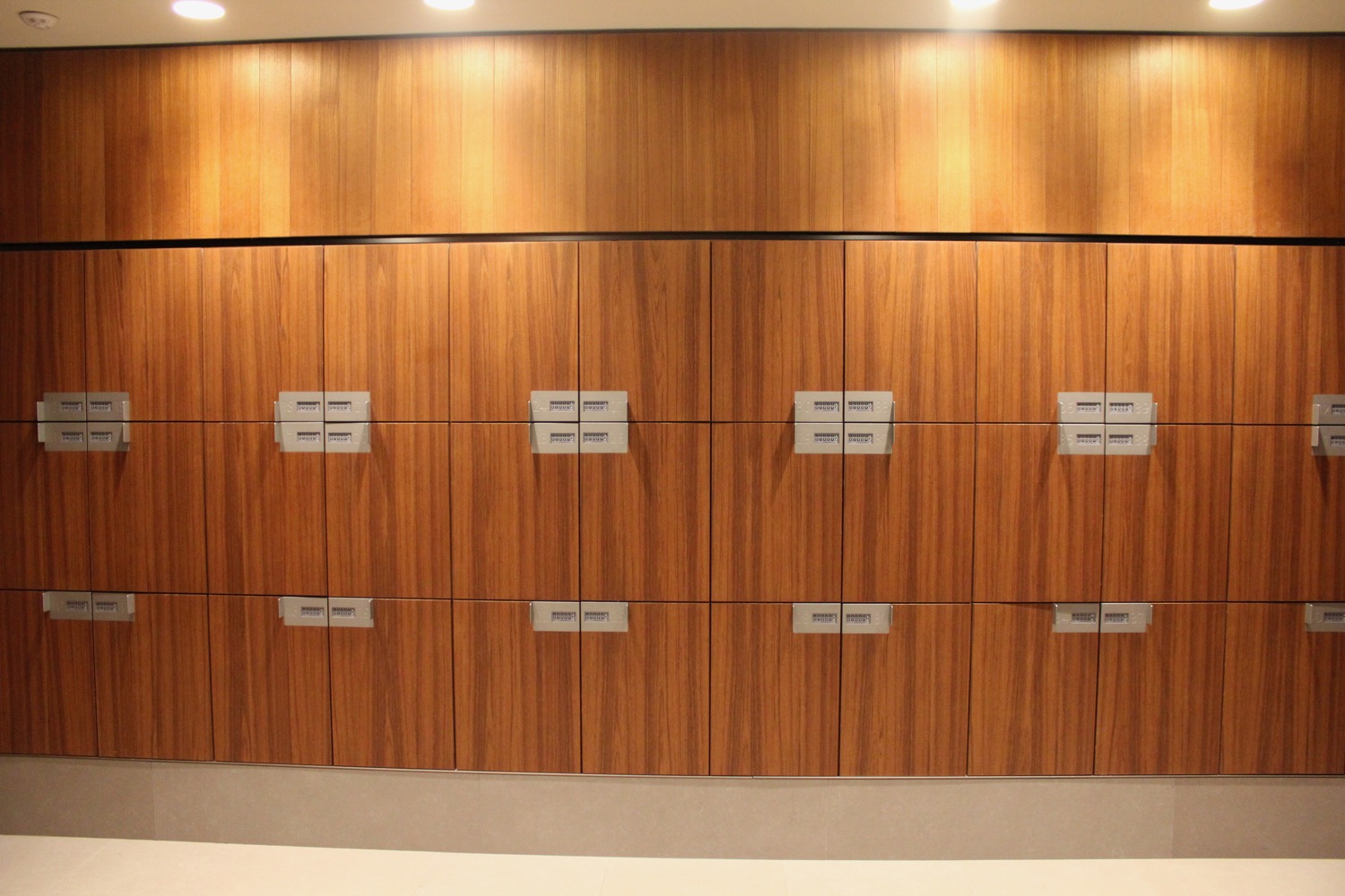 a wooden lockers with silver handles