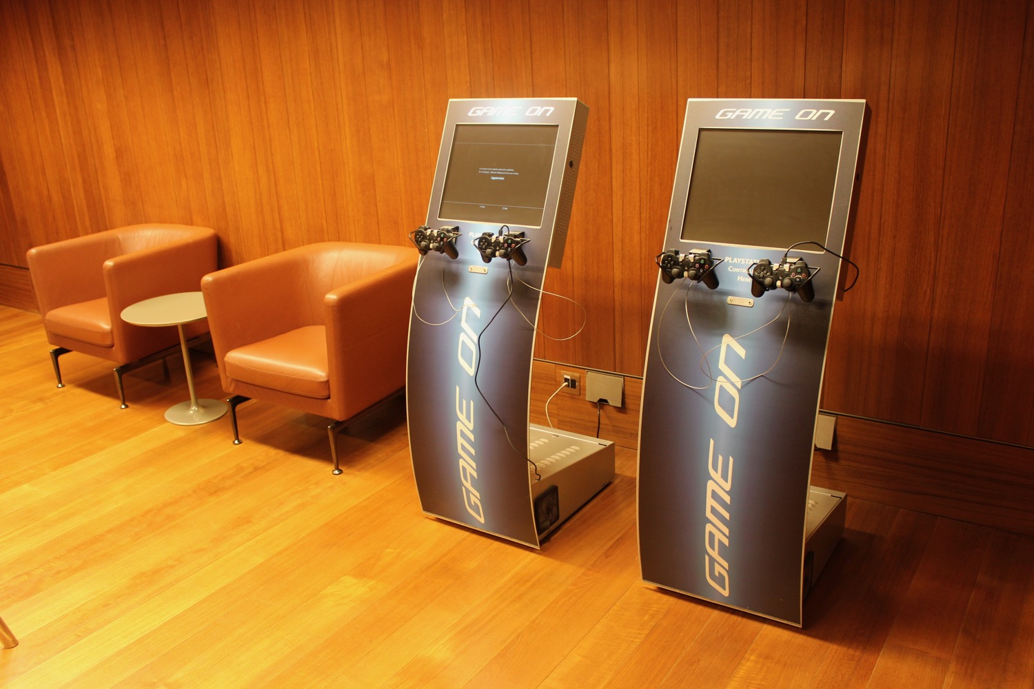two game machines in a room