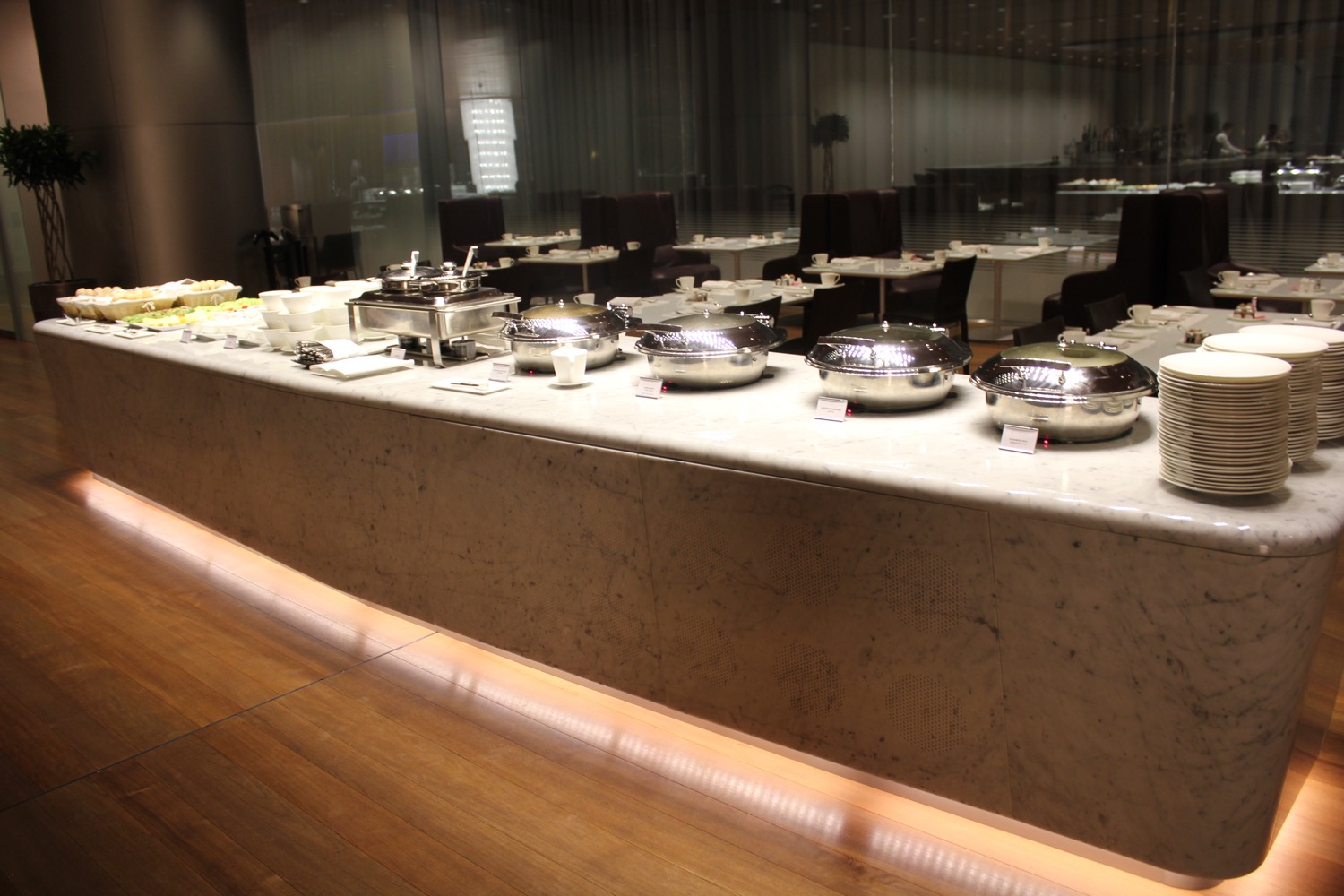 a buffet table with silver bowls