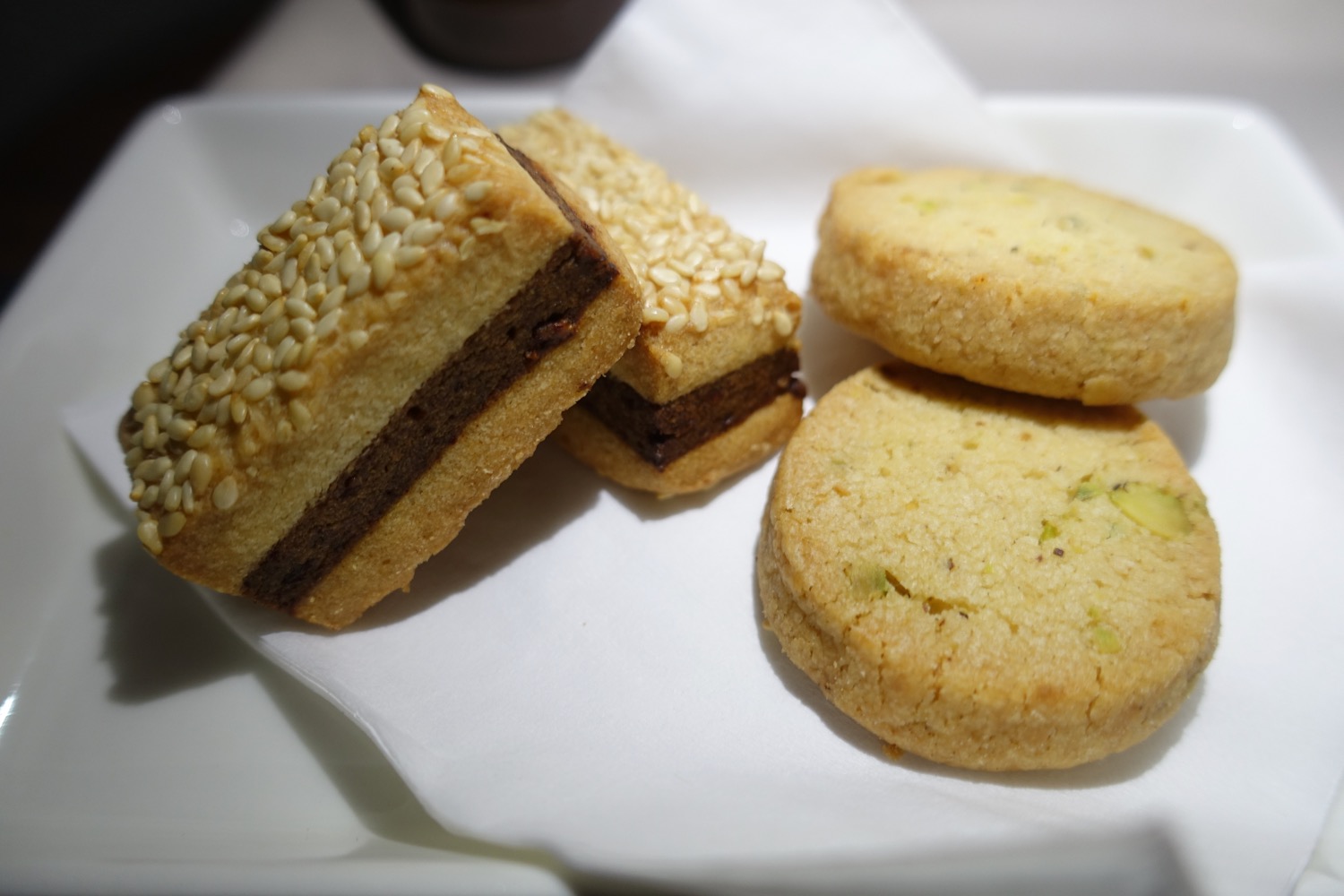 a plate of cookies and a sandwich