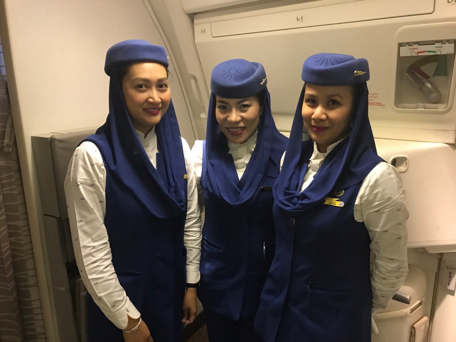 a group of women wearing blue uniforms and hats
