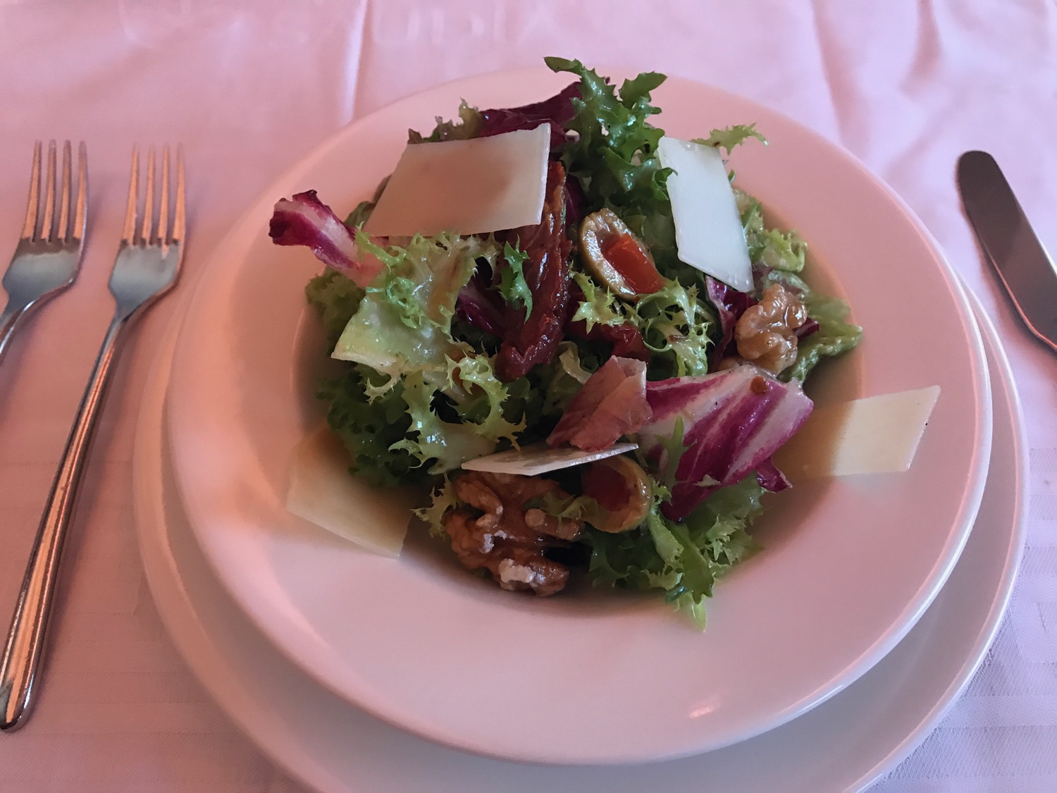 a plate of salad with a fork