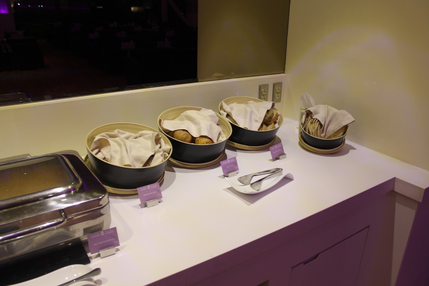 a row of bowls with food in them