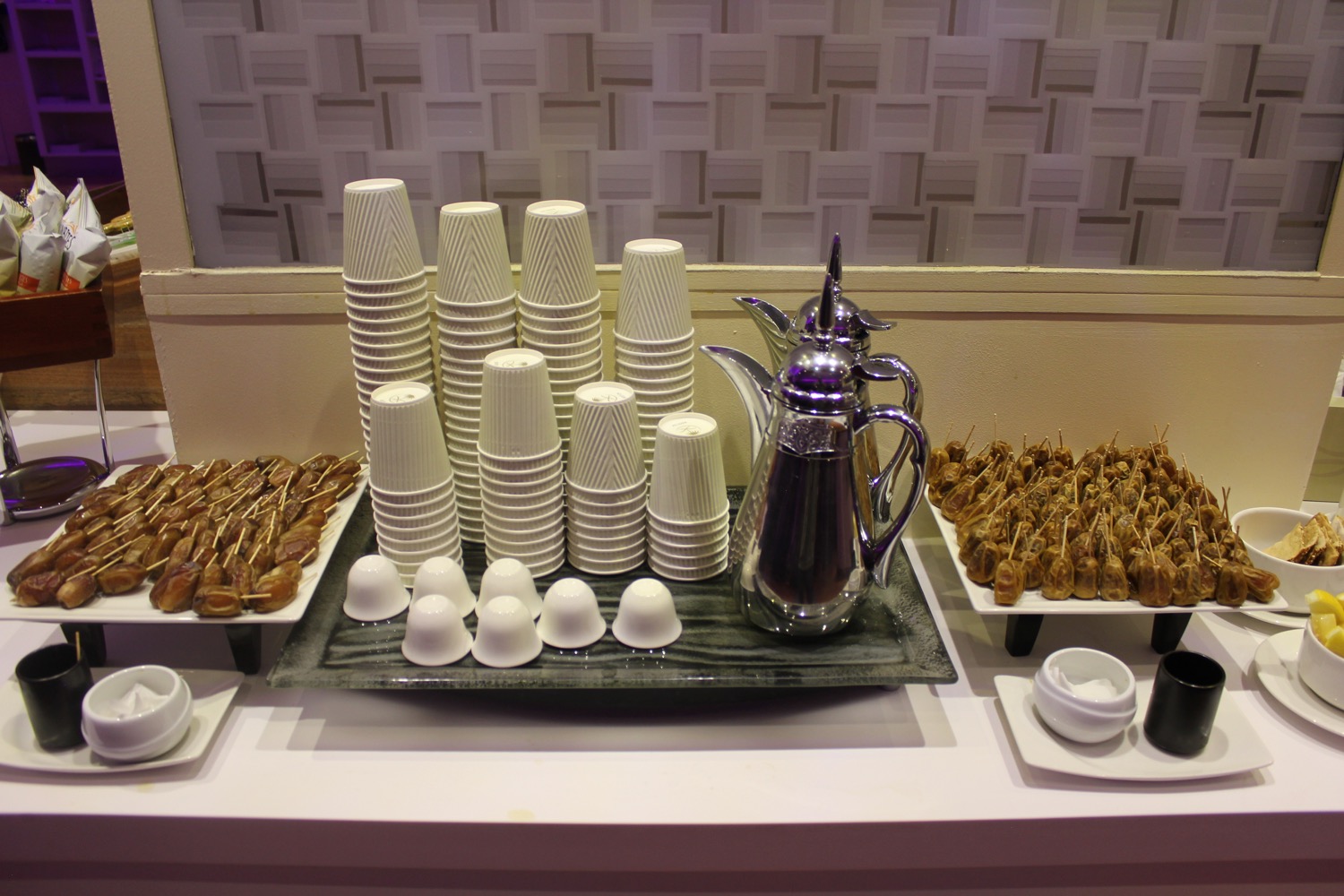 a tray of coffee cups and cups on a table