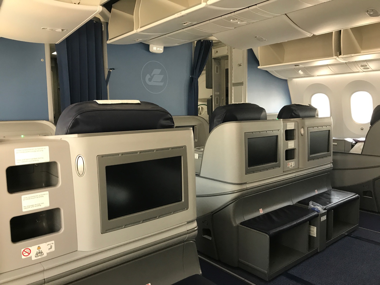 a seats and a television in an airplane