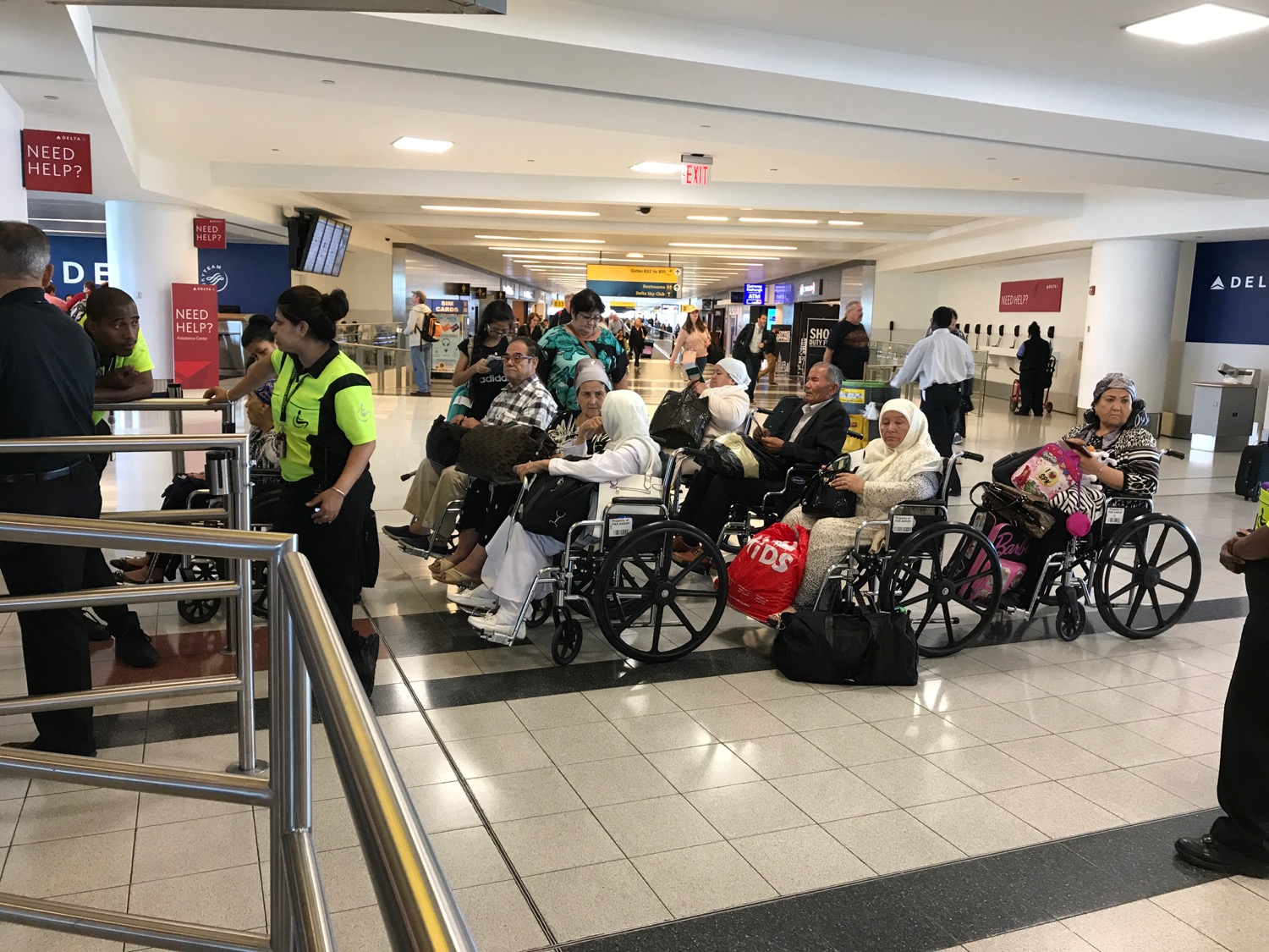 a group of people in wheelchairs in an airport
